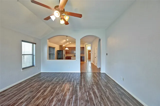 a kitchen with stainless steel appliances granite countertop a sink refrigerator and microwave