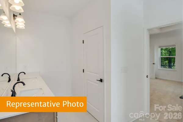 a bathroom with a granite countertop sink a toilet and bathtub