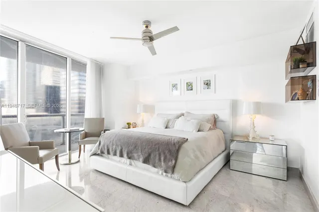 a bathroom with a granite countertop sink a mirror and a shower
