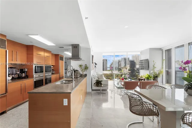 a kitchen with sink a counter and cabinets