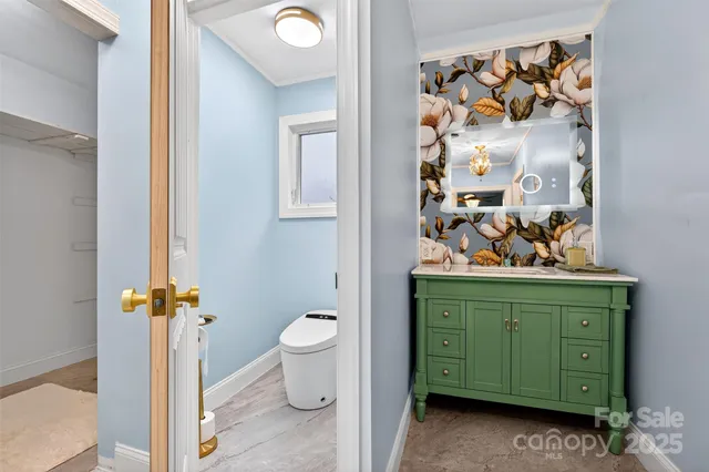 a view of a bathroom with a sink and mirror