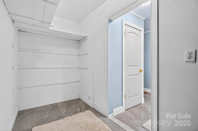 a view of an empty walk in closet