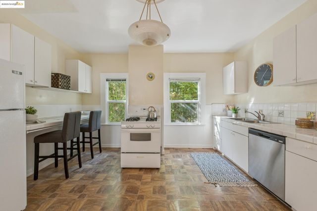 a kitchen with a table and chairs in it