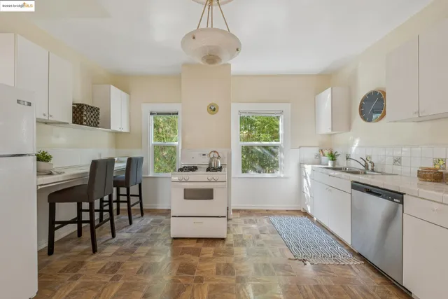 a kitchen with a table and chairs in it