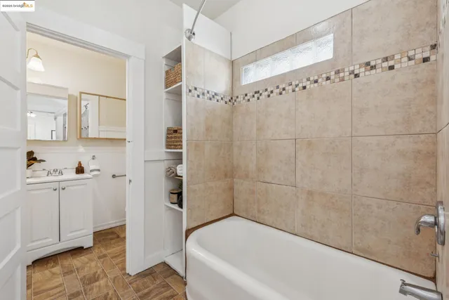 a bathroom with a bathtub a toilet and a shower