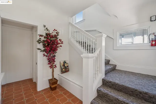 a view of entryway with wooden floor and stairs