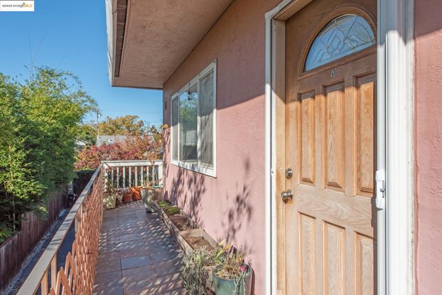 a view of balcony with wooden floor