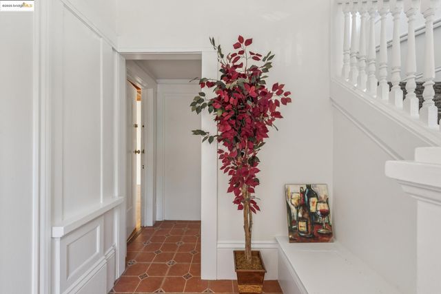a vase of flowers sitting on a floor