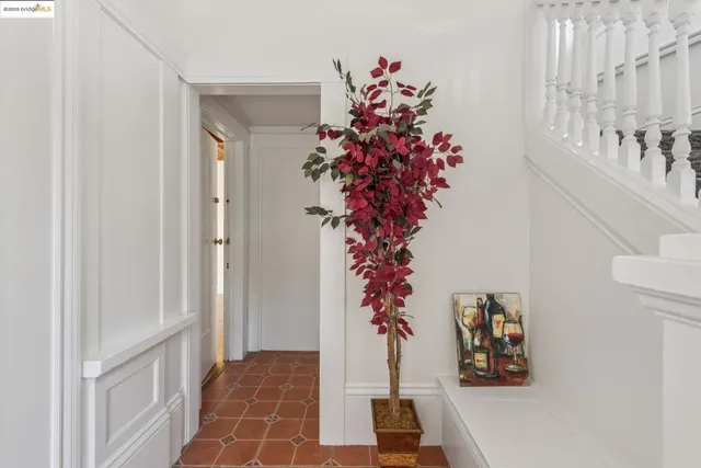 a vase of flowers sitting on a floor