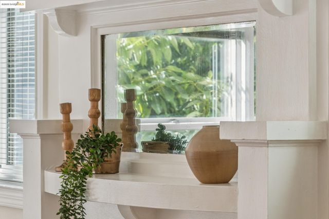 a glass vase sitting on top of a window