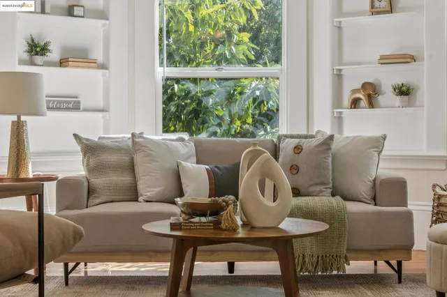 a living room with furniture and a window