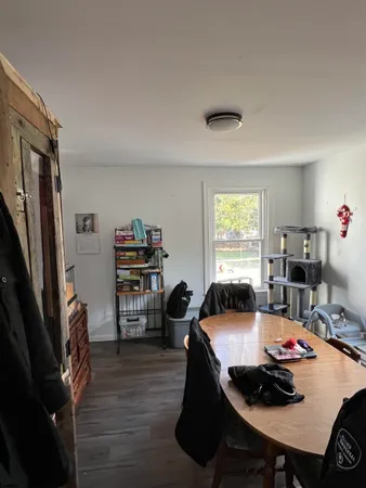 a workspace with furniture window and wooden floor