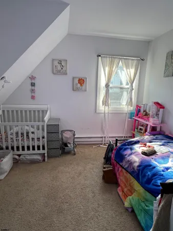 a bed room with furniture and a window