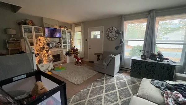 a living room with furniture and a flat screen tv