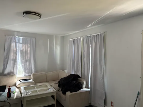 a room with a couch and a window
