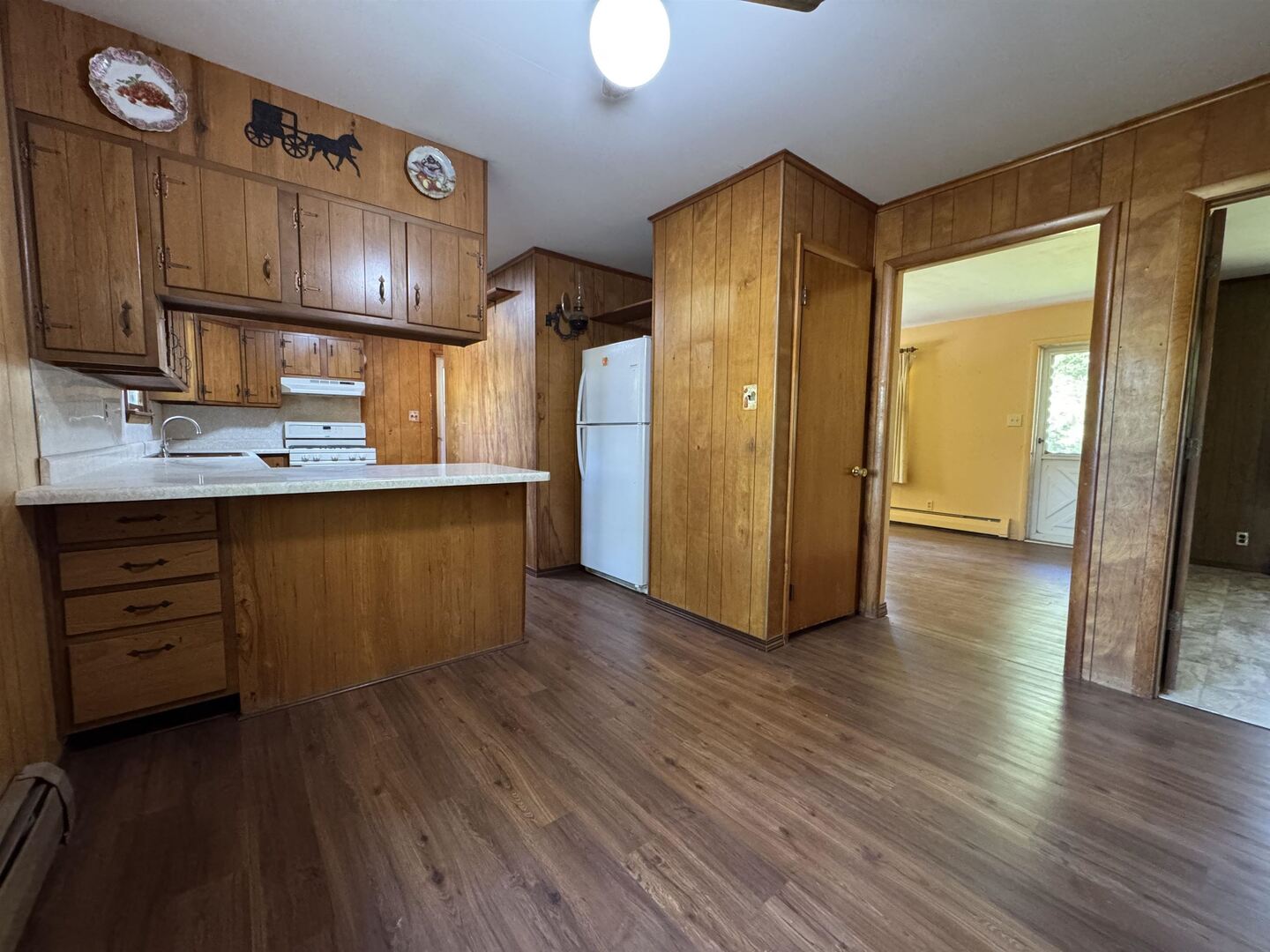 3536 West Grange Hall Road Murphysboro, IL 62966 - Photo 14 of 40 a kitchen with stainless steel appliances granite countertop a refrigerator a sink and wooden cabinets