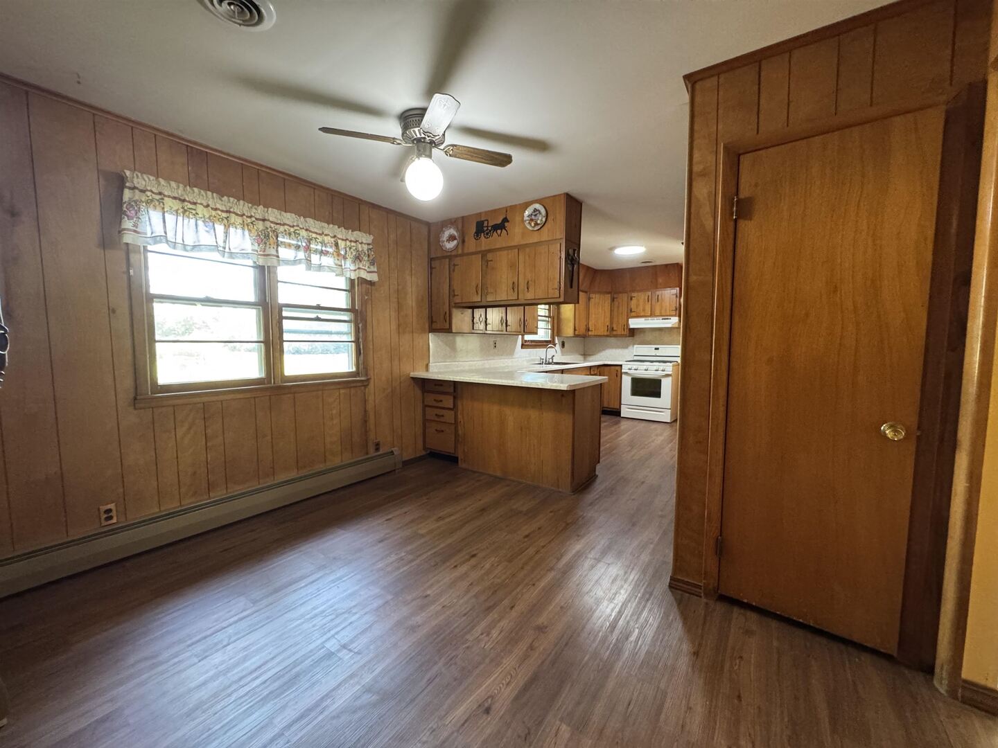3536 West Grange Hall Road Murphysboro, IL 62966 - Photo 15 of 40 a view of a kitchen counter space wooden floor and window