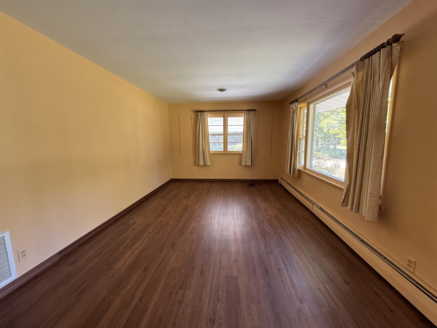 3536 West Grange Hall Road Murphysboro, IL 62966 - Photo 8 of 40 a view of an empty room with wooden floor and a window