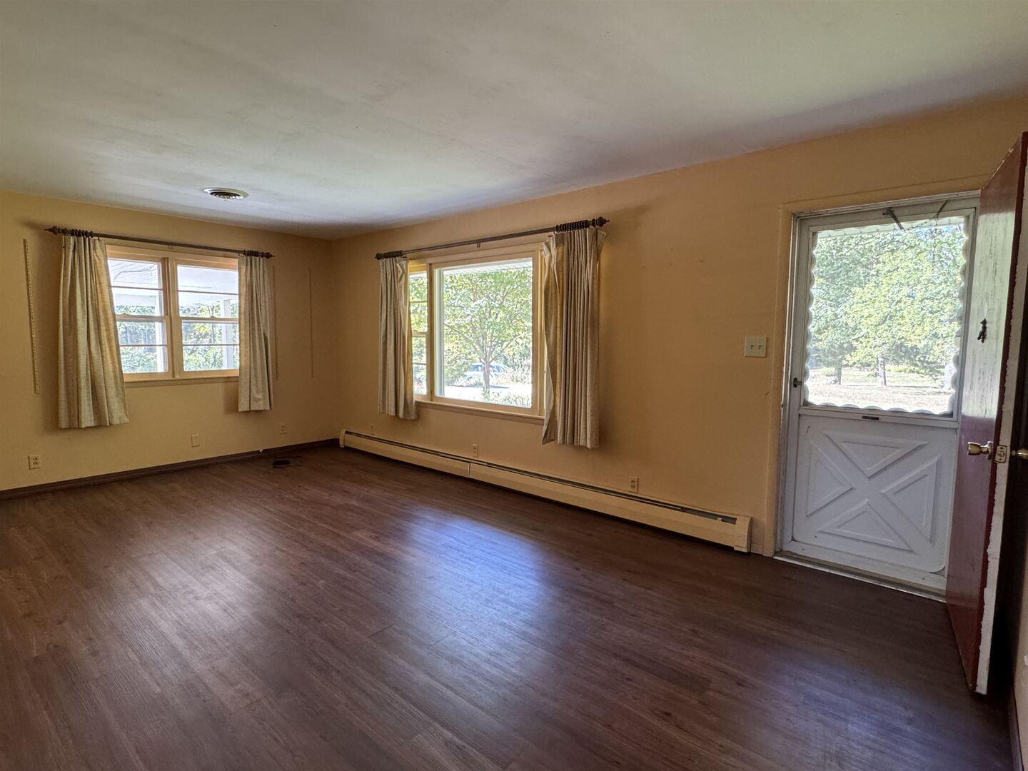 3536 West Grange Hall Road Murphysboro, IL 62966 - Photo 9 of 40 an empty room with wooden floor and windows
