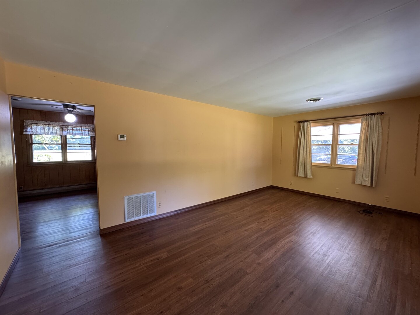 3536 West Grange Hall Road Murphysboro, IL 62966 - Photo 10 of 40 an empty room with wooden floor and windows