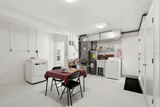 a kitchen with a refrigerator and a stove top oven