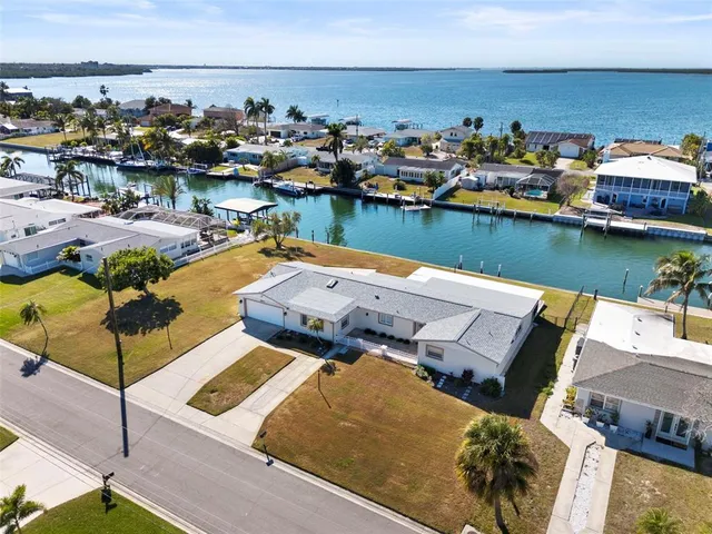 an aerial view of a house with a swimming pool
