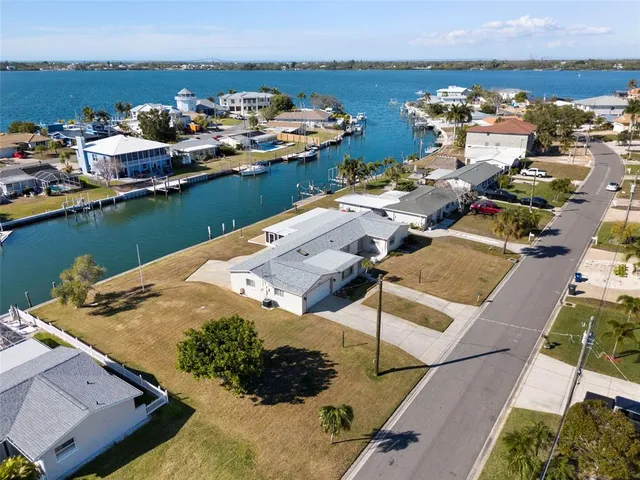 an aerial view of a house with a ocean view