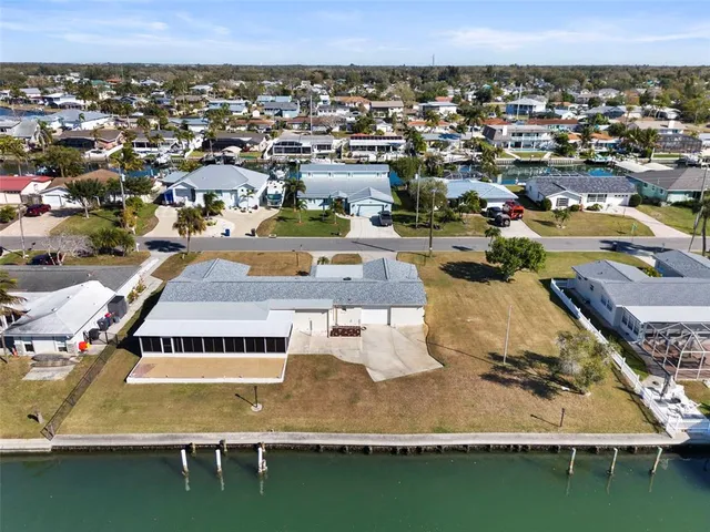 an aerial view of a house with a lake view