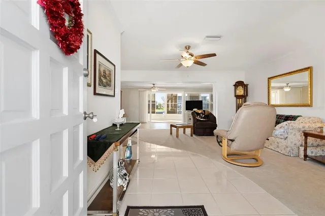 a living room with furniture a chandelier