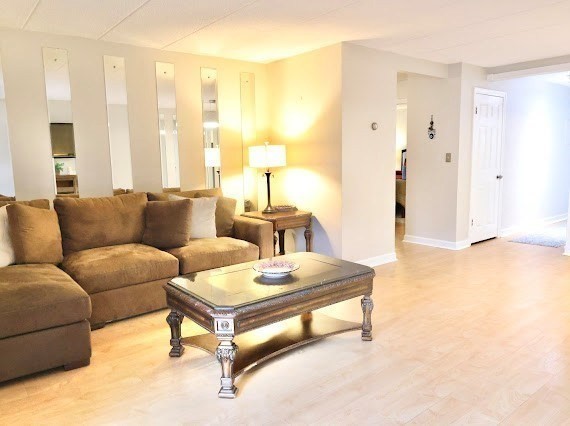16 Winter Street, Unit 43B Waltham, MA 02451 - Photo 3 of 12 a living room with furniture and a table