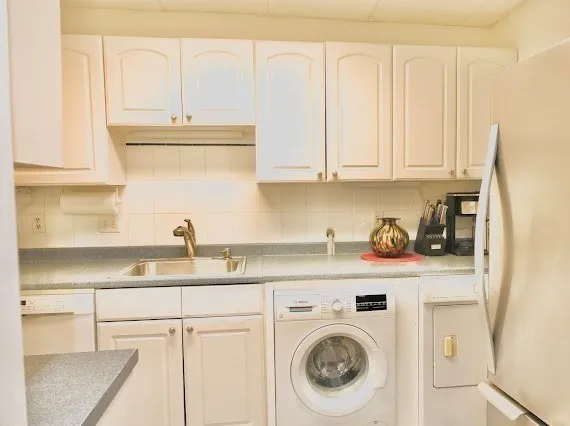 a kitchen with a sink and cabinets