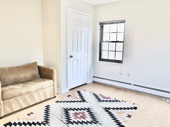 16 Winter Street, Unit 43B Waltham, MA 02451 - Photo 9 of 12 a living room with a bed