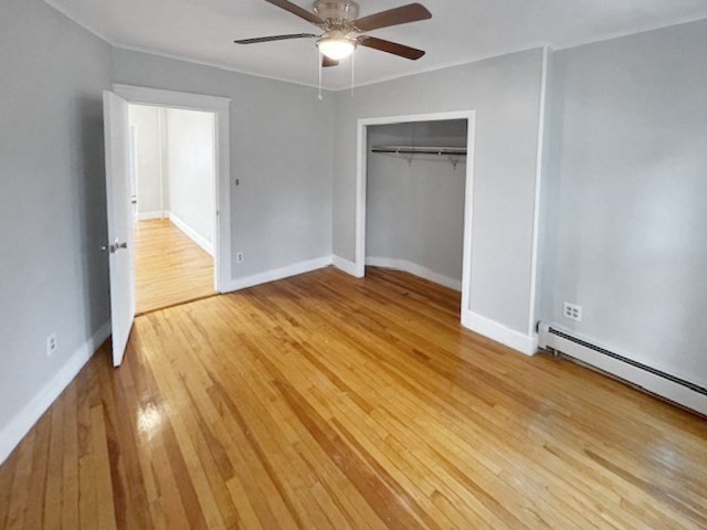 80 Delmont Avenue Worcester, MA 01604 - Photo 11 of 35 an empty room with wooden floor and windows