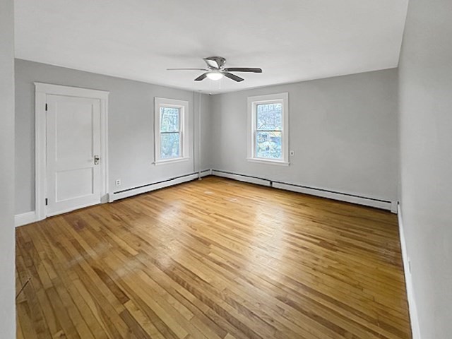 80 Delmont Avenue Worcester, MA 01604 - Photo 12 of 35 a view of empty room with wooden floor and fan