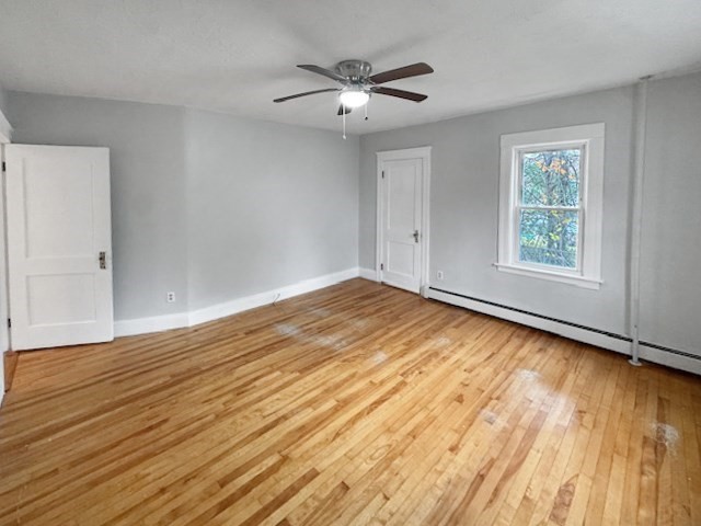 80 Delmont Avenue Worcester, MA 01604 - Photo 13 of 35 an empty room with wooden floor and windows