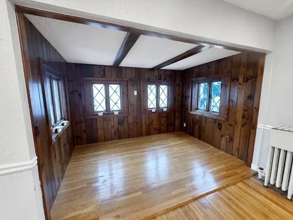 a view of entryway with stairs and wooden floor