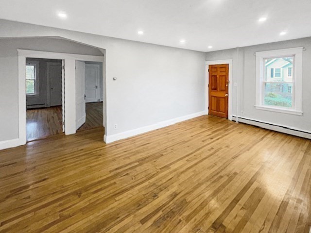 80 Delmont Avenue Worcester, MA 01604 - Photo 7 of 35 a view of an empty room with wooden floor and a window
