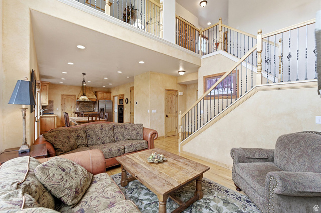 3634 North Huntsman Path, Unit C203 Eden, UT 84310 - Photo 8 of 27 Two-story living area featuring wood-finish flooring and recessed lighting