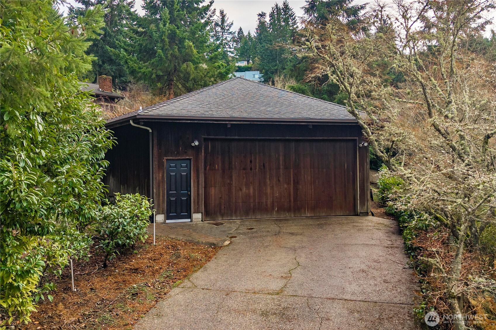 2617 Southwest 163rd Street Burien, WA 98166 - Photo 25 of 31 a front view of a house with a garden
