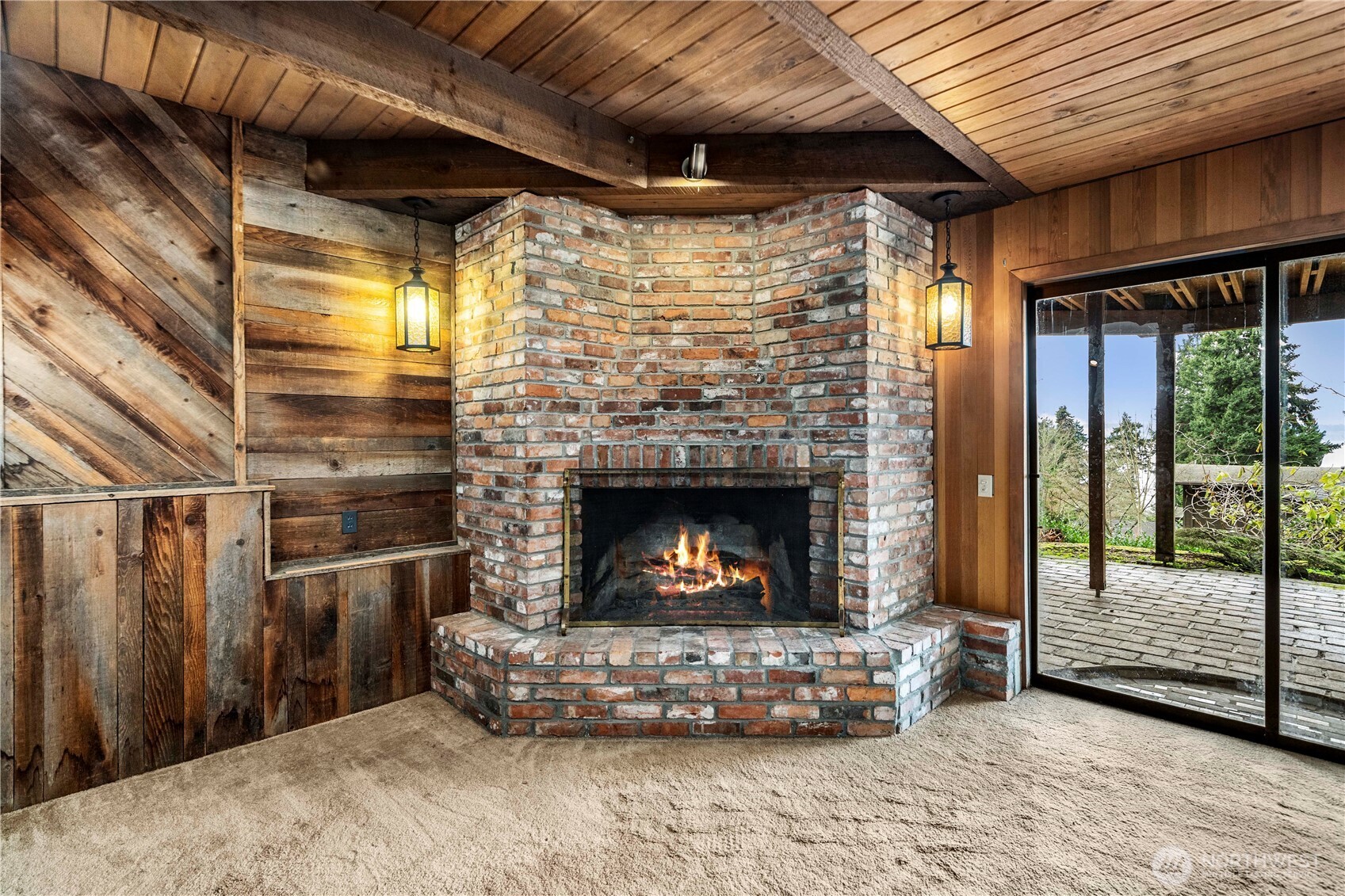 2617 Southwest 163rd Street Burien, WA 98166 - Photo 4 of 31 a living room with stainless steel appliances furniture a fireplace and a wooden floor