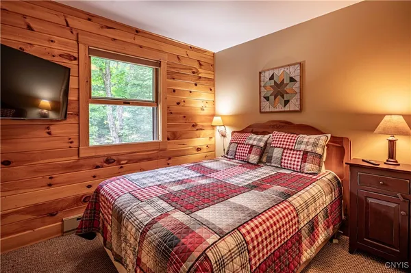 $1,299,900 | 112 Holiday Drive, Webb, NY 13420