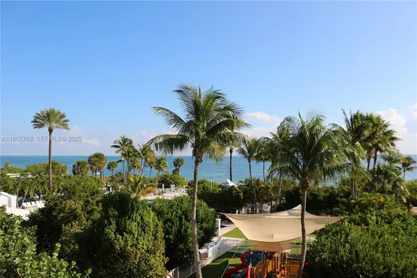 a view of a house with a swimming pool and a patio