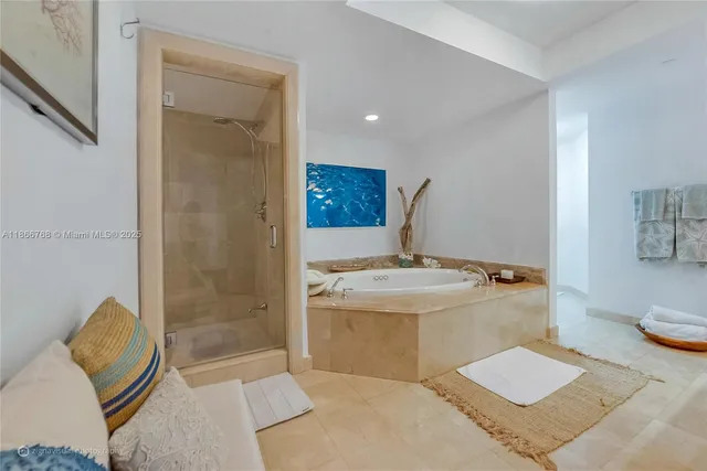 a bathroom with a granite countertop sink a toilet and shower