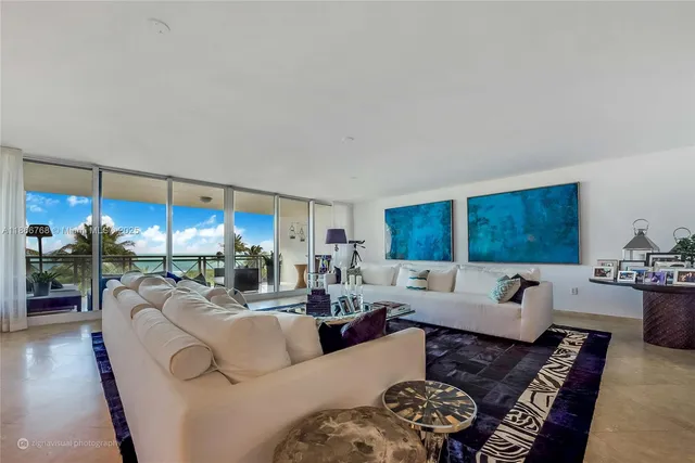 a living room with furniture potted plant and a window