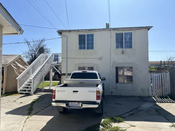 a car parked in front of a house