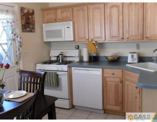 38 Parkerson Road Edison, NJ 08817 - Photo 5 of 8 a kitchen that has a cabinets and a stove