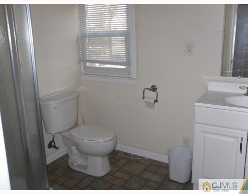 38 Parkerson Road Edison, NJ 08817 - Photo 7 of 8 a bathroom with a toilet and a sink