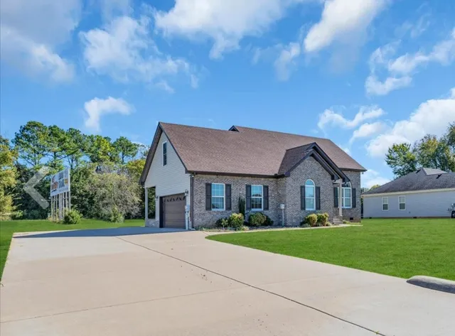 a front view of a house with garden