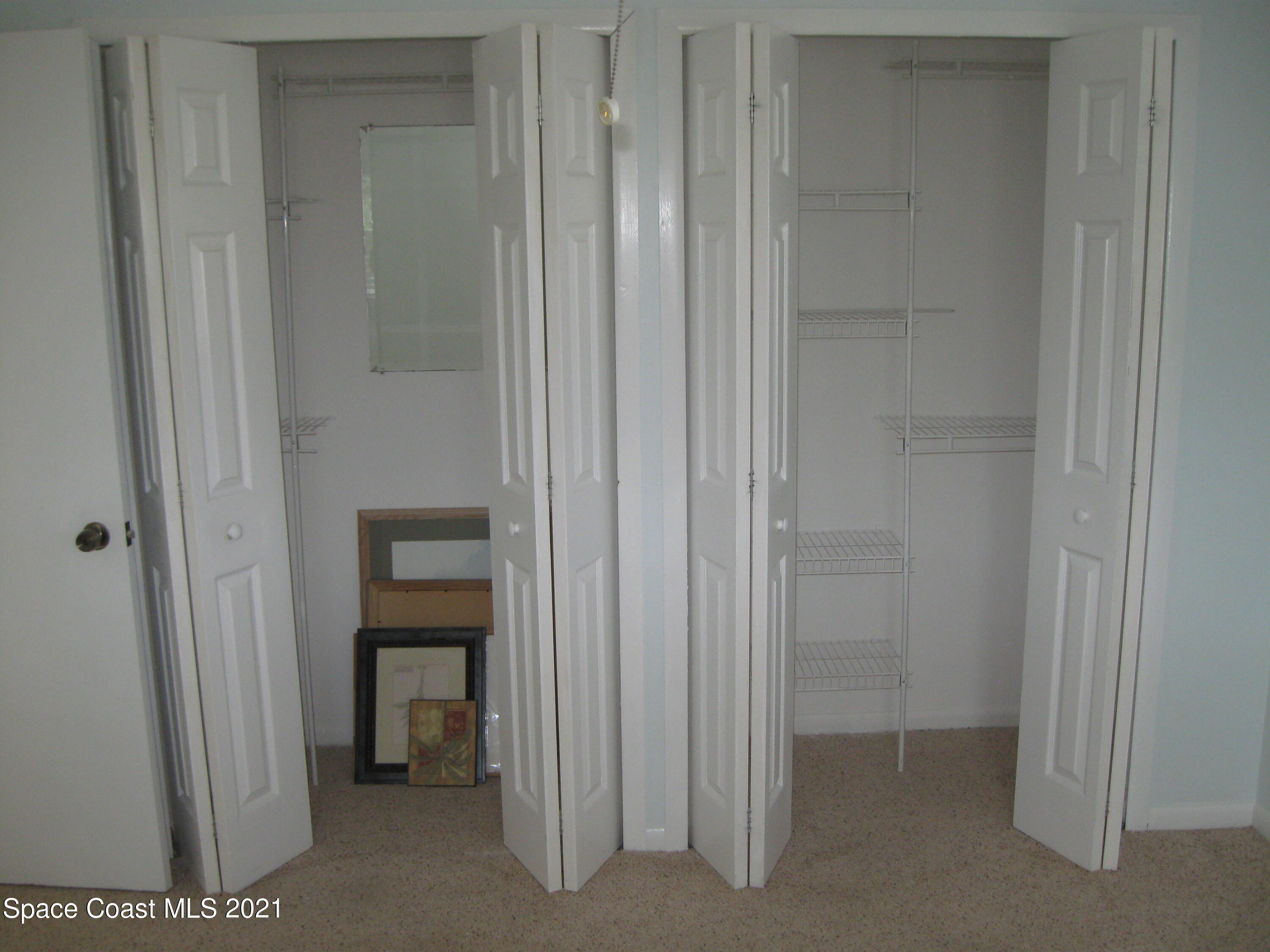 770 Sandgate Street Merritt Island, FL 32953 - Photo 12 of 22 a view of a bathroom from a hallway