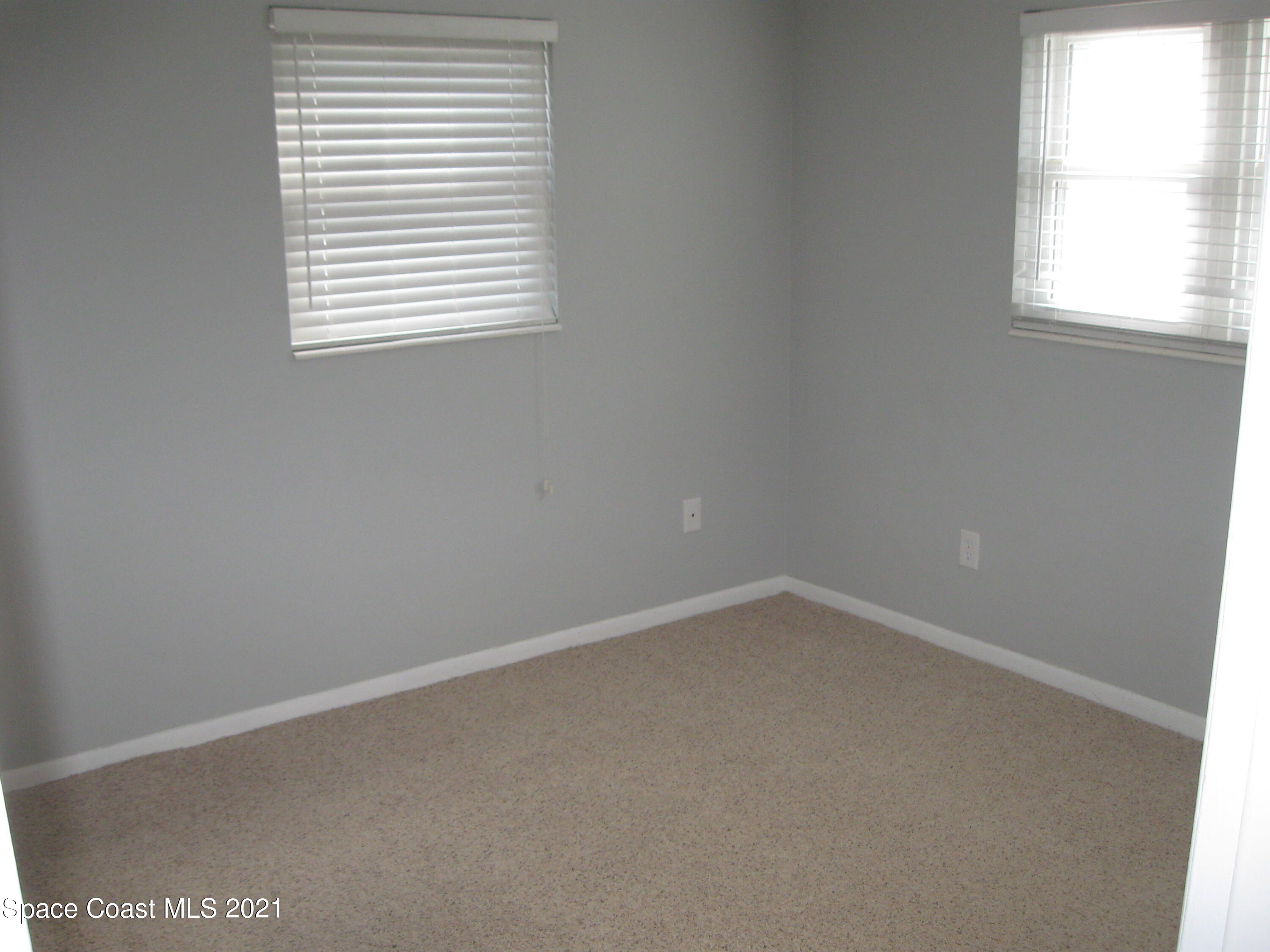 770 Sandgate Street Merritt Island, FL 32953 - Photo 16 of 22 an empty room with a window
